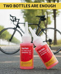 Bike with two bottles of Kachaa hydraulic mineral oil for All In One Hydraulic Brake Bleed Kit With 120ml Mineral Oil, Funnel, Syringes And Adapters For MTB And Road Disc Brakes, Easy At Home Maintenance For Multiple Popular Brand Systems.