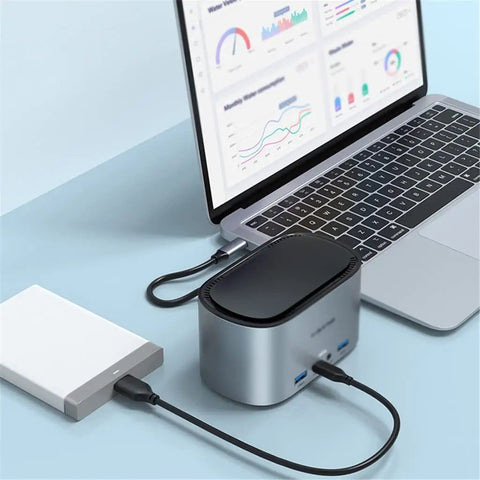 Solid Game Changer 13 In 1 Usb C Docking Hub For Laptops With 4K 60Hz Output Rj45 Gigabit Ethernet And Ngff Ssd Slot Plug And Play connected to a laptop.