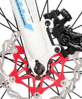 High Quality Mechanical Disc Brake Set For Mountain Bike Featuring Front And Rear Aluminum Alloy Calipers With Killer Stopping Power And Street Tough Build Quality That Lets You Shred Trails Without A Care While Rolling Smooth; close-up view of front brake caliper and rotor.