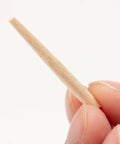 Close-up of a tapered wooden nail for woodworking and craft projects, 9/64 inch (3.5mm), natural Japanese white birch, made in Japan