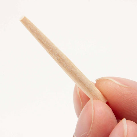 Close-up of a tapered wooden nail for woodworking and craft projects, 9/64 inch (3.5mm), natural Japanese white birch, made in Japan