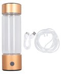 Portable Hydrogen Water Bottle With Nasal Inhalation Hose 410ml, gold top, USB cable, clear inhalation hose, power button visible.