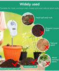 All In One Garden Sensor With Removable Probe For Soil Moisture And PH Testing Plus Fertility, Sunlight Intensity, Temperature And Humidity Readouts For Gardens, Lawns And Farms AAA Battery Included in orange plant pot with soil types illustration