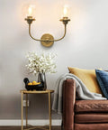 Antique Brass Double Sconce Wall Light With Clear 5.9 Inch Globe Shade in a living room, E26 base, dimmable with compatible bulbs