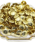 Top Tier 500 Piece Gold Metal Upholstery Tacks For Furniture Reupholstering And Cork Boards stacked in a decorative dish.