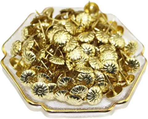 Top Tier 500 Piece Gold Metal Upholstery Tacks For Furniture Reupholstering And Cork Boards stacked in a decorative dish.