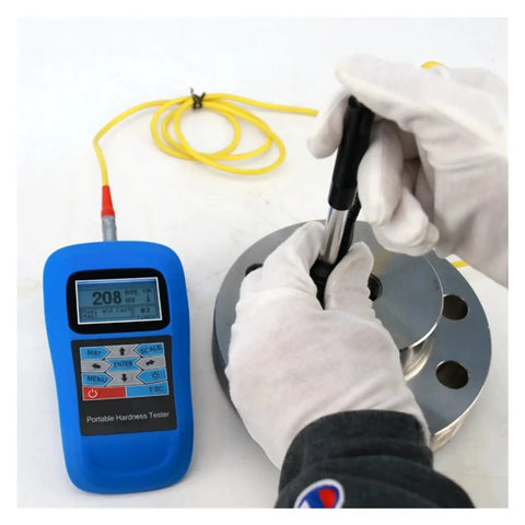 Dead On Reading Digital Leeb Hardness Tester With Beefy Metal Housing And Simple Usb Pc Hookup For Rockwell Brinell Vickers Scale Gauge Job Plus Crisp Backlit Lcd Screen Gear being used on a metal surface.