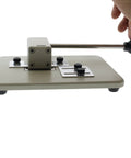 Heavy Duty Desktop Slot Punch For ID Cards And Bulk Badges With Precision Adjustable Slide Guides, side view showing handle.