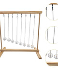 Hands On Pendulum Cradle Science Kit For Home Office And School DIY Educational Toy Demonstrating Pendulum Period Versus Length And Energy Conservation Through Fun Experiments, wooden frame close-up with metal balls.