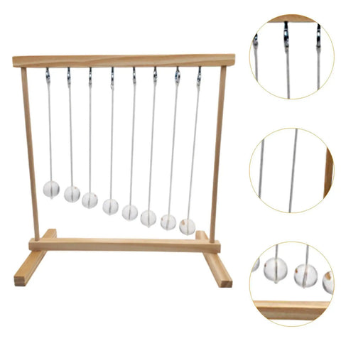 Hands On Pendulum Cradle Science Kit For Home Office And School DIY Educational Toy Demonstrating Pendulum Period Versus Length And Energy Conservation Through Fun Experiments, wooden frame close-up with metal balls.