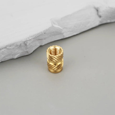 Heat Set Inserts M5 Brass Knurled Threaded Inserts 5x10x7mm for Plastic on gray surface