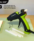 Dual Temp All Purpose Full Size Hot Glue Sticks For Crafts And DIY 0.43 By 4 Inches next to green-black glue gun on table