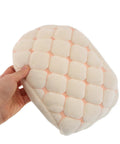 Hella Cozy Beige Plush Motorcycle Seat Cover With Super Warm Winter Fluffy Padding held in hand, featuring soft padded quilted design.