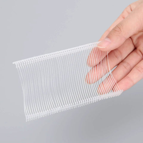 2 Inch Tagging Gun Fasteners 5000 Pack Pro Grade Heavy Duty Clothing Tag Barbs Attachments in hand, white, tangle-proof.