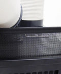 Close-up of black mesh filter area on Heavy Duty 8 Liter Portable Air Conditioner With Easy Glide Casters For Garages And Backyard Hangouts 15400 Btu Spot Cooler.