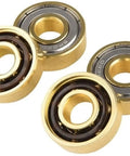 Gold Titanium Skate Bearings Set Eight Pieces 608Z 8Mm Bore 22Mm OD 7Mm Width For Skateboards Longboards Inline Skates Scooters And Quad Artistic Skating For All Styles And Tricks Pro Grade Construction Smooth Spin, featuring detailed close-up of shiny gold titanium bearings, smooth and durable design.