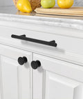 Installed Matte Black Solid Cabinet Pulls 5 Inch 128mm Hole Centers on white kitchen cabinet drawer.