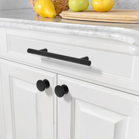 Installed Matte Black Solid Cabinet Pulls 5 Inch 128mm Hole Centers on white kitchen cabinet drawer.
