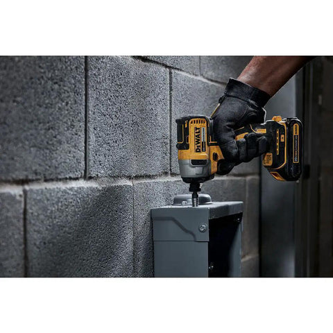 Using 20V Max Cordless Impact Driver Kit With Brushless Motor One Quarter Inch Hex Chuck Two Batteries And Charger LED Light on concrete
