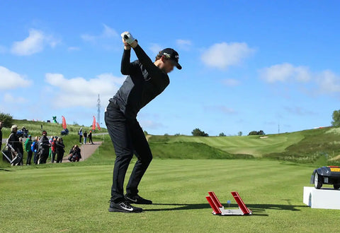 Golfer uses Golf Swing Training Aid With Pro Grade Putting Mirror And Alignment Mat For Swing Path Feedback on green