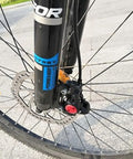 CYSKY bike hydraulic brake hose kit installed on front MTB disc brake; black hose with red connector cap.