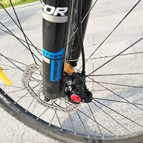 CYSKY bike hydraulic brake hose kit installed on front MTB disc brake; black hose with red connector cap.