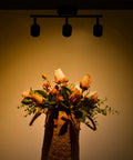 Arcfox 24W Three Light LED Track Lighting Kit illuminating a floral arrangement with dimmable rotatable heads on ceiling mount.