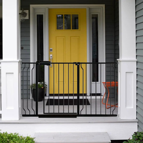 Walk Through Baby Gate For Stairs 34 To 38.5 Inches Wide With Door Pressure Mounted No Drill Safety Gate in Tension Metal Black installed on porch