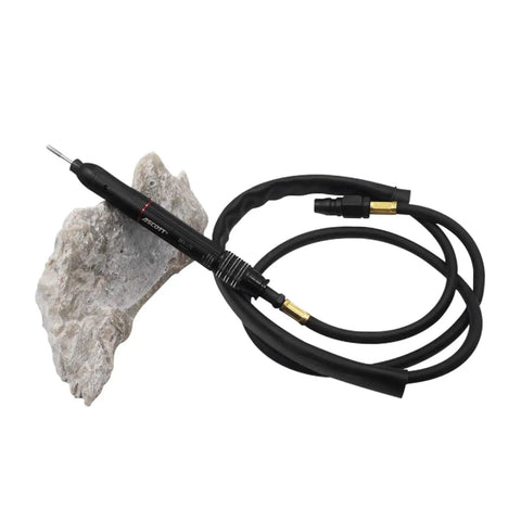 Mini Pneumatic Die Grinder Kit High Speed Adjustable Air Polishing Pen For Engraving And Detail Work connected to air hose resting on rock.