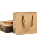 Kraft Paper Gift Bags Set Of 20 For Birthday Bashes And Weddings, featuring stacked and standing eco-friendly kraft bags.