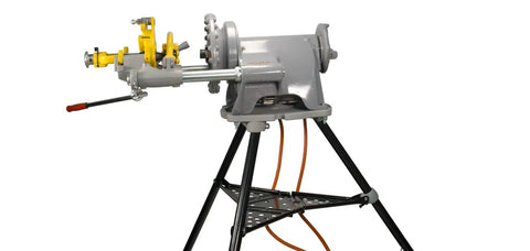 Reconditioned Model 300 Pipe Threader With Foot Pedal Control And Universal Quick Swap Die Heads side view on sturdy stand.