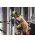 Person using Hard Hitting 18V Brushless Drill And Impact Driver Kit With Two 1 5Ah Batteries on metal studs.