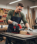 Person using Adjustable Push Block For Table Saw And Router Table With Safe And Stable Grip Sliding Height And Base Width Heavy Duty Anti Slip Woodworking Pusher For Jointer And Band Saw with woodworking tools and safety gear in a workshop setting.
