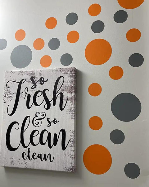 Bold Orange And Grey Polka Dot Vinyl Wall Decals Set Of 30 Removable Adhesive Stickers for nurseries displayed on wall
