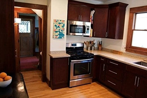 Modern kitchen with dark wood cabinets featuring 12mm Diameter Brushed Stainless Steel T Bar Cabinet Handles Hollow Pulls 8 Inch Overall Length.