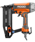 Orange and gray nail gun with black magazine, featuring a 16 gauge nail slot, angled for finish carpentry and woodworking projects.
