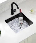 17x15 Black Undermount Bar Sink Built To Last For Home Bars And Prep Stations Pro Grade Heavy Duty Stainless Steel filled with ice and a wine bottle