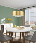 Gorgeous Six Light Pendant Featuring Brushed Nickel Drum Shade And Clear Faceted K9 Crystals hanging over a modern dining table.