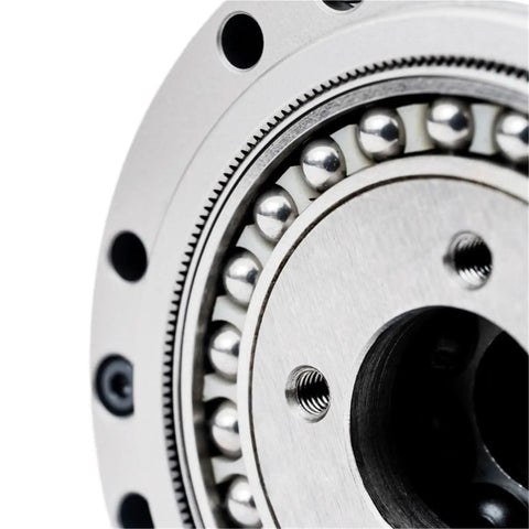 Close-up of Solid As A Rock High Precision Cylindrical Gear Reducer with hard tooth surface and ball bearings.