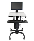 Smooth Roll Single Monitor Sit Stand Desk With Zero Effort Height Lift And Heavy Duty Caster Wheels For Vesa Monitors Up To Twenty Four Inches, including keyboard and mouse.