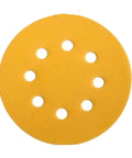 Get Your Hands On These Awesome 5 Inch Sanding Discs With 8 Holes For Perfect Dust Extraction And Smooth Surfacing Jobs Using 320 Grit Abrasive Paper Sheets For Fine Finishing And Heavy Duty Work Ready Projects, close up of yellow sanding disc.