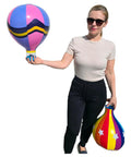 Person holding Multicolor 18 Inch Inflatable Hot Air Balloons Set With 3 Designs 3 Pack for kids parties and favors.