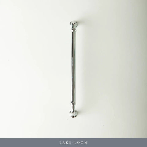 Chrome towel rail on white wall, minimal design