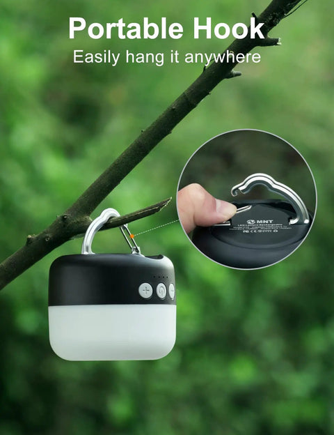 Rechargeable Camping Lantern 1000 Lumen LED Light With 6700mAh Power Bank hanging from a branch via portable hook.