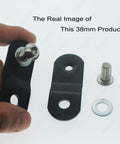 Hand holding black 38mm steel riser from Gas Tank Rising Lift Kit For Harley Big Twin Dyna Softail Touring Bikes 1 pair