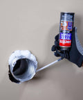 Person applying Big Gaps Spray Foam Sealant That Expands To Fill And Insulate Up To Three Inches, 12 Fl Oz Can to a wall gap.