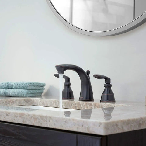 Avalon Two Handle 8 Inch Widespread Bathroom Faucet in Polished Chrome Deck Mount with flowing water, modern sink view.