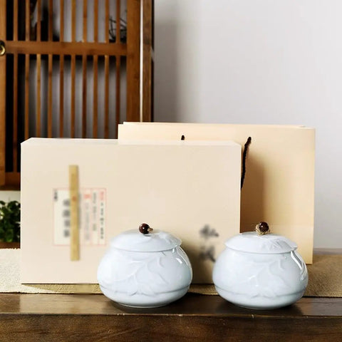 Premium Ceramic Tea Canister Set For Kitchen Straight Up Airtight Coffee Bean Storage Jar with two blue jars on a wooden table.