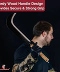 Person holding Curved Machete For Brush Busting And Outdoor Use Ready To Go Carbon Steel Blade No Sharpening Needed Sickle Knife