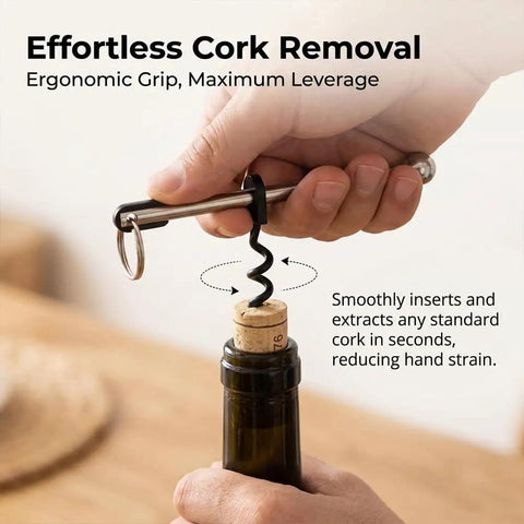Using a Pocket Size Wine Opener Keychain with Stainless Steel Corkscrew for effortless cork removal from wine bottle.